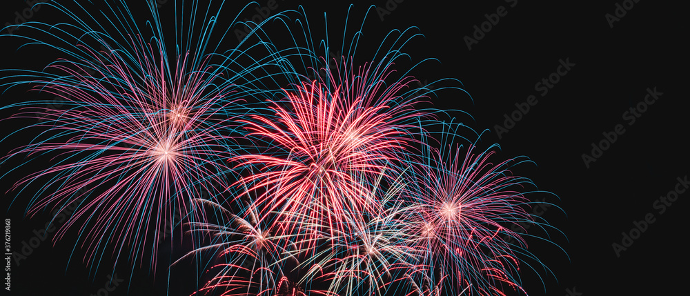 real colorful fireworks in the night sky, colorful fireworks on black background