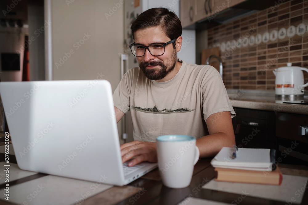 Portrait of handsome young man working in home office, copy space Portrait of handsome young man working in home office, copy space