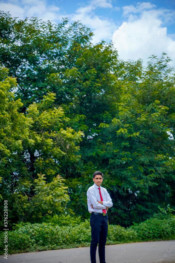Young asian / Indian boy Standing on the road Young asian / Indian boy Standing on the road