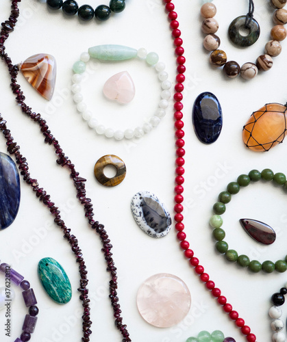 Multicolored semi-precious stones on a white background