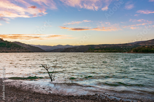 Pantano Beznar with a sky of clouds at sunset. photo