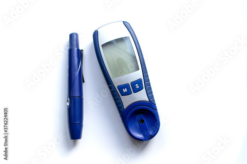 Blue blood glucose meter on a white background. View from above. Diabetes concept.