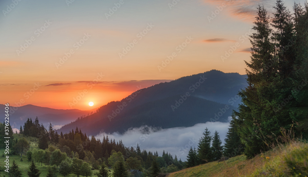 Colorful and bright sunrise in the mountains.
