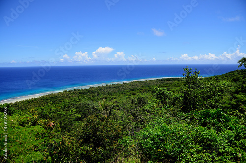 Lush green tropical vegetation and deep blue seas, high angle view above Ritidian Point, Guam, Micronesia © RobertCoy