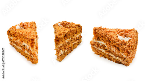 Peace of honey cake isolated on white background.