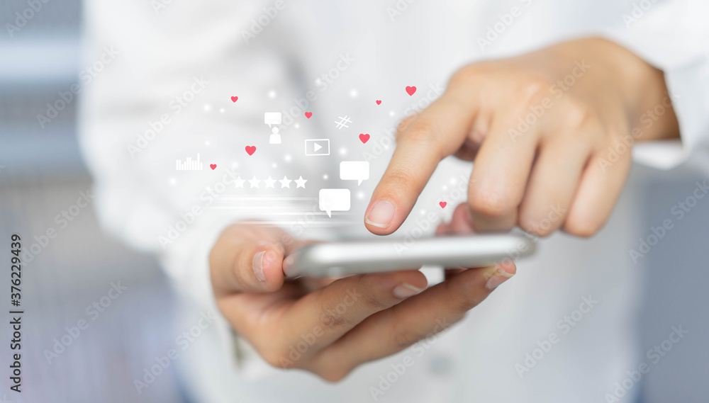 close up on man holding smartphone to play entertainment of social media marketing for internet network technology and business concept close up on man holding smartphone to play entertainment of social media marketing for internet network technology and business concept
