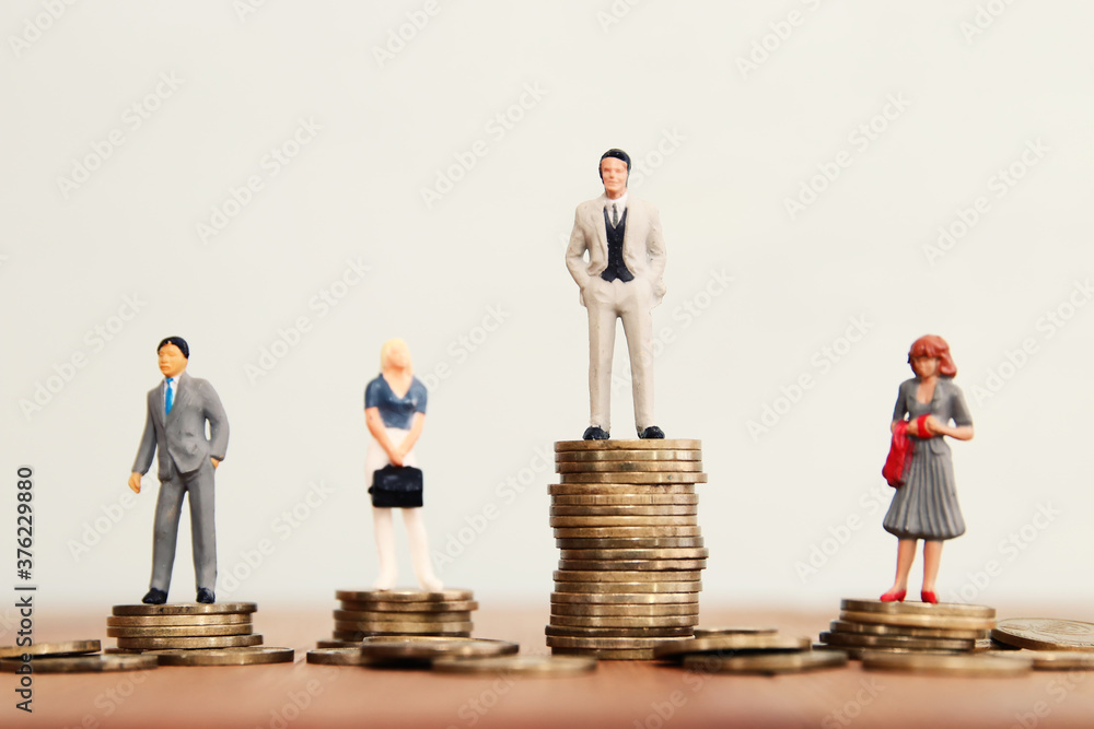 Conceptual image of gender inequality. A women and a men with income difference Conceptual image of gender inequality. A women and a men with income difference