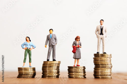 Conceptual image of gender inequality. A women and a men with income difference