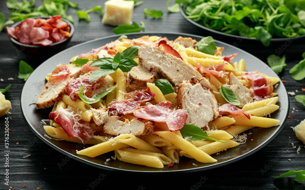 Chicken, bacon Penne pasta with parmesan cheese and basil. healthy food. Chicken, bacon Penne pasta with parmesan cheese and basil. healthy food.