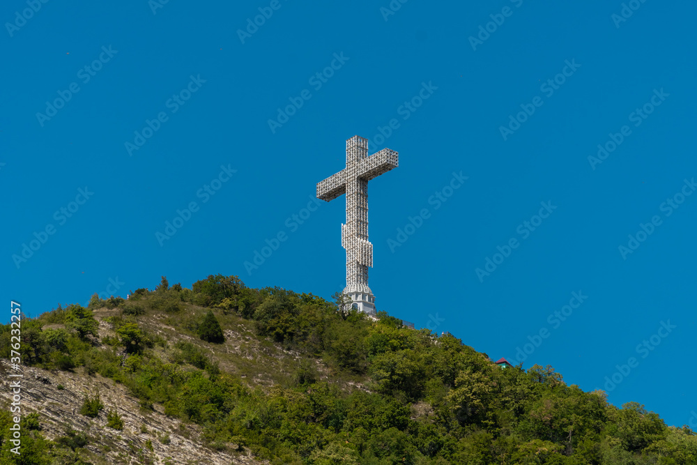 High 43-meter Orthodox cross on the Markhotsky ridge with a view of The Gelendzhik Bay.