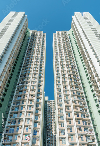 Exterior of high rise residential building of public estate in Hong Kong city © leeyiutung