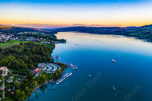 Sunset by the lake with alpine panorama