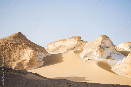 Fototapeta Naklejka Na Ścianę i Meble -  Desert landscape with sanddunes and rock formations. Bahariya nature reserve egypt. Extreme travel destinations. Sahara nature scene. Exploring wild nature 
