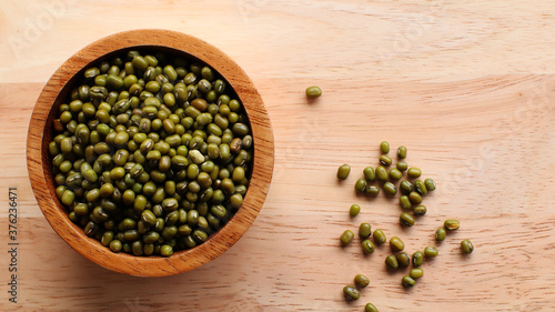 Green bean seeds in a wooden bowl