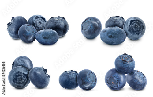 Set of fresh ripe blueberries on white background