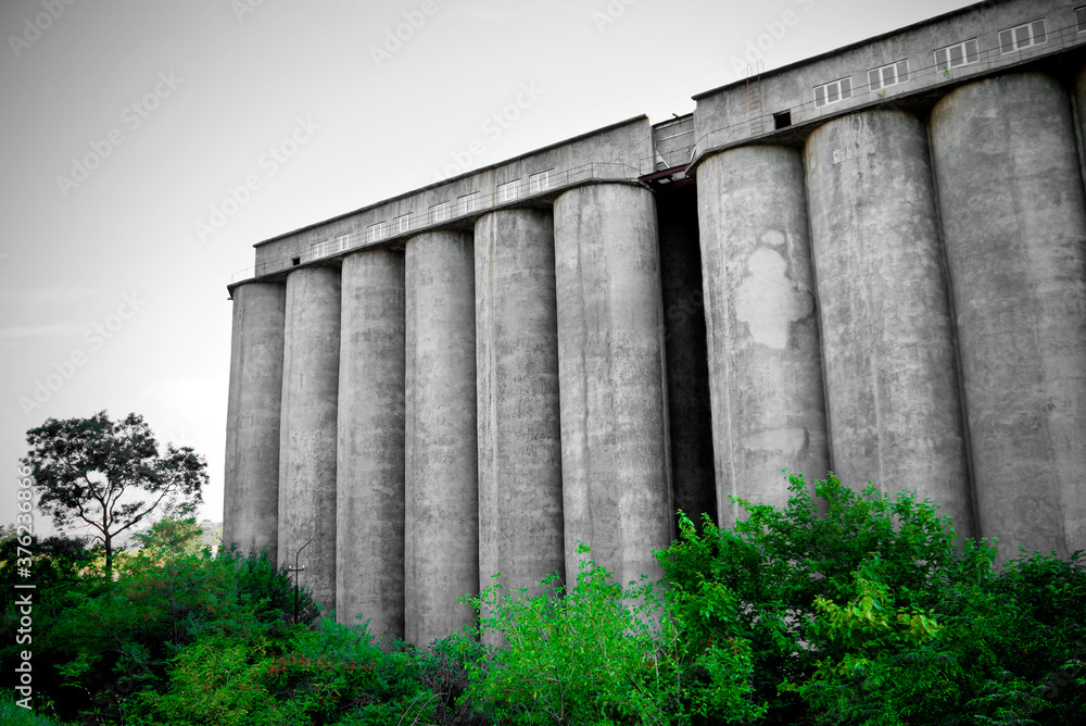 Abandoned flour factory concrete containers. Abandoned factory.