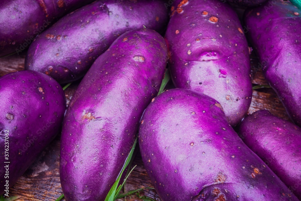 Background with purple potatoes close up