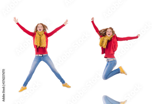 Cute smiling girl in red jacket and jeans isolated on white