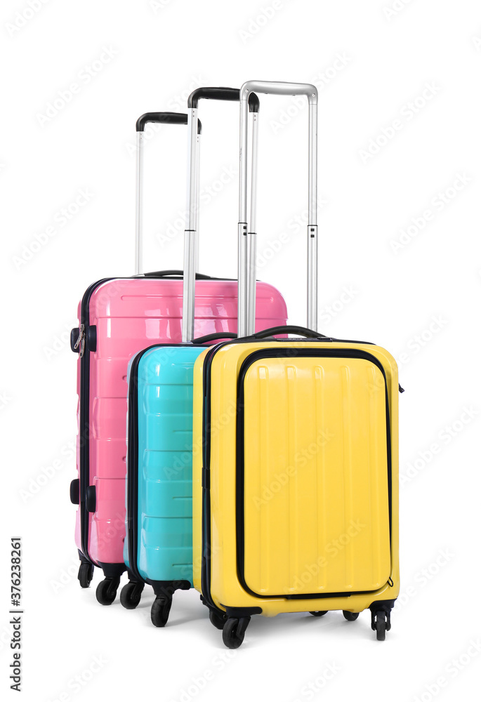 Stylish suitcases packed for travel on white background. Summer vacation Stylish suitcases packed for travel on white background. Summer vacation