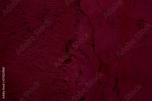 Crimson colored abstract background with textures of different shades of crimson and red