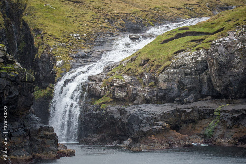 small waterfall in the mountains small waterfall in the mountains