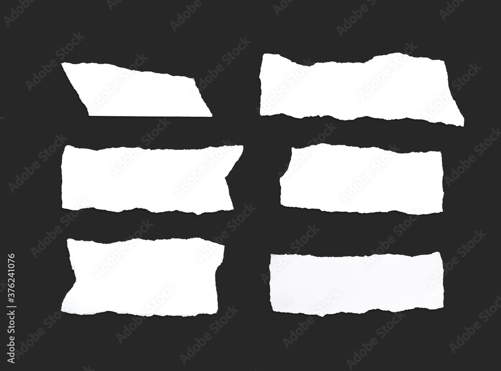 White ripped note, notebook paper stuck with sticky tape on black background. White ripped note, notebook paper stuck with sticky tape on black background.