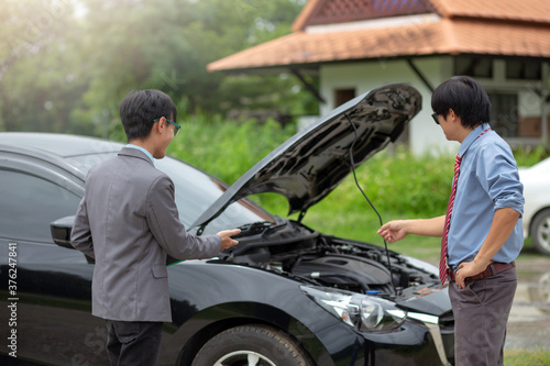 Car insurance agent talks to his client about claiming a car repair service.