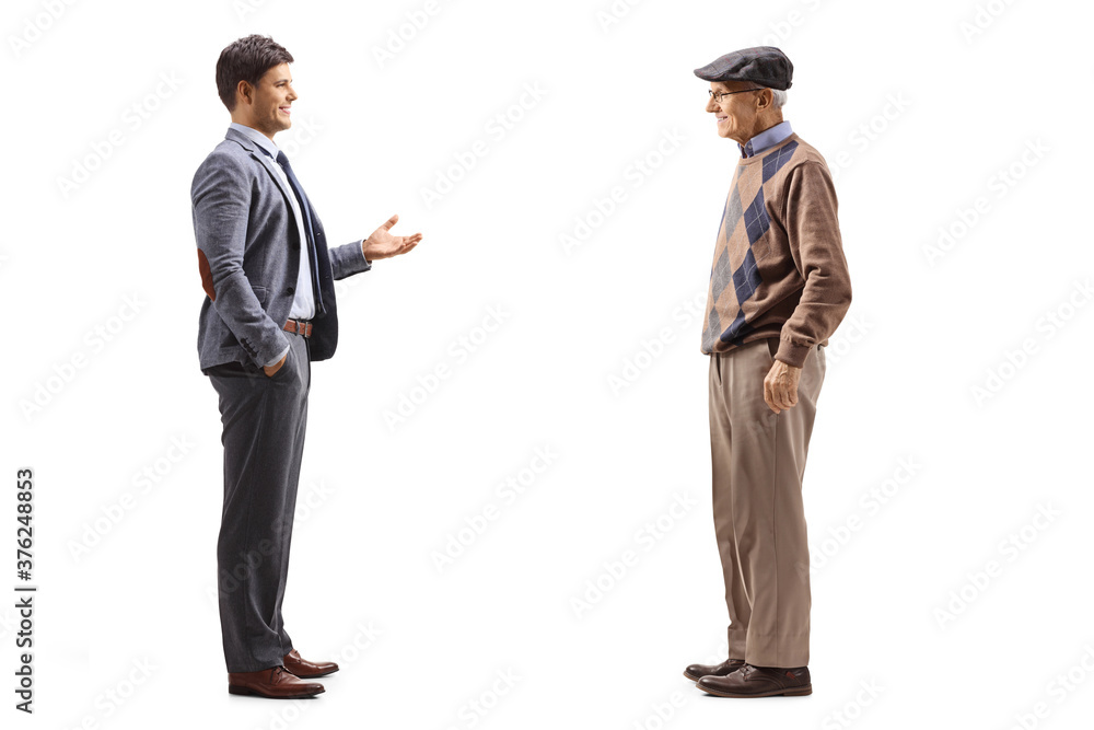 Full length profile shot of a man in a suit talking to his elderly father Full length profile shot of a man in a suit talking to his elderly father