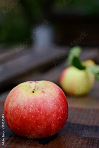 Ripe beautiful apples on a wooden background. Autumn harvest