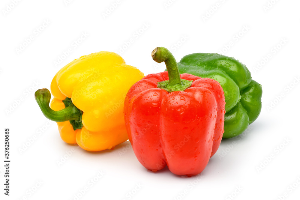 Pile of bell pepper with water drops isolated on white background.