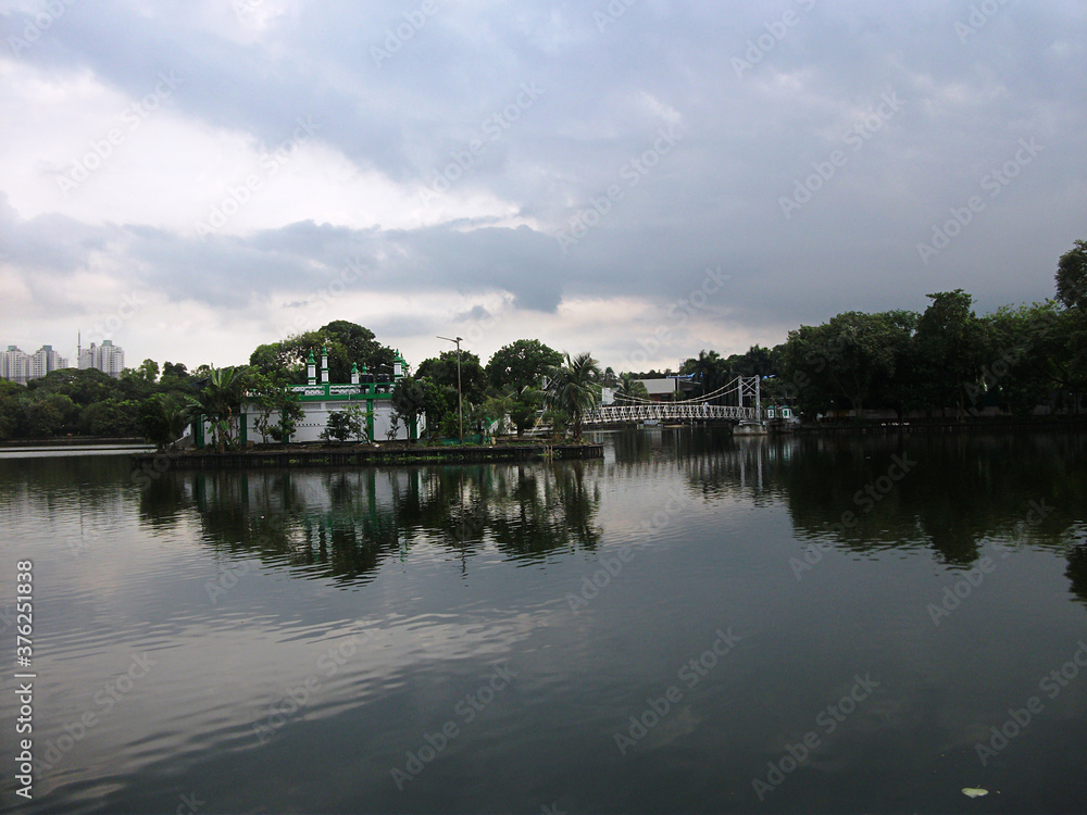 Mosque on the opposite side of the lake at Dhakuria Lake, Kolkata, India. 