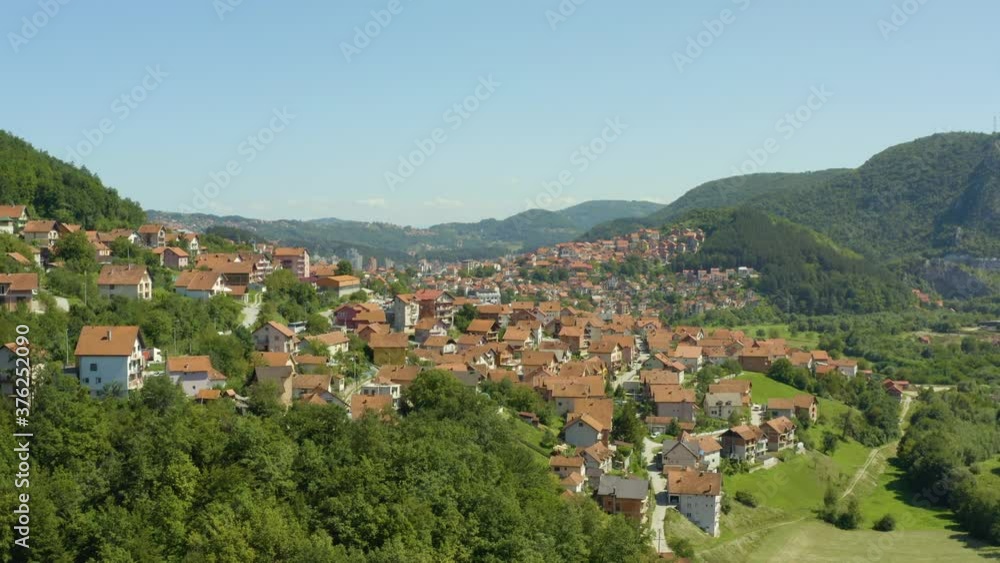 Aerial shot Uzice Serbia. Drone video of the city with houses in which red roofs can be seen streets, east, landscape, mountains. Aerial shot Uzice Serbia. Drone video of the city with houses in which red roofs can be seen streets, east, landscape, mountains.