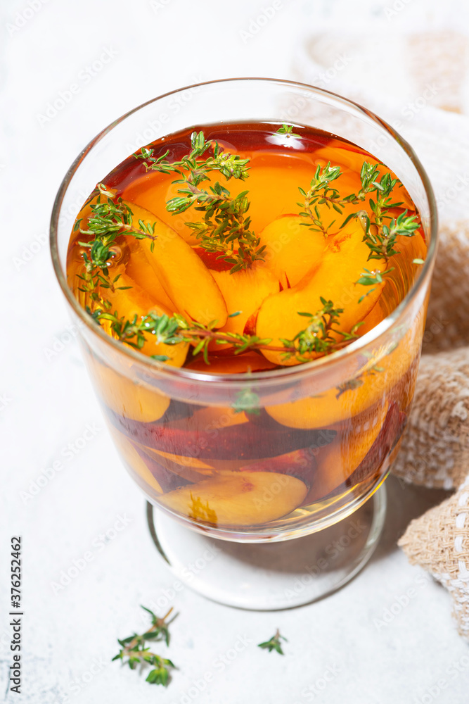 black tea with plum and thyme, closeup black tea with plum and thyme, closeup