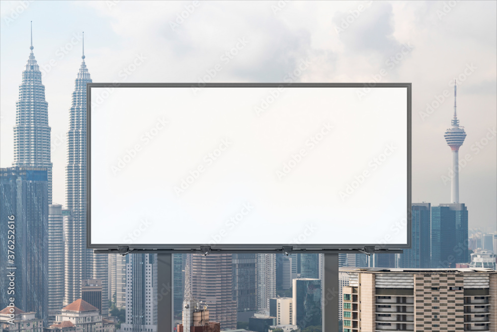 Blank white road billboard with KL cityscape background at day time. Street advertising poster, mock up, 3D rendering. Front view. The concept of marketing communication to promote or sell idea. Blank white road billboard with KL cityscape background at day time. Street advertising poster, mock up, 3D rendering. Front view. The concept of marketing communication to promote or sell idea.