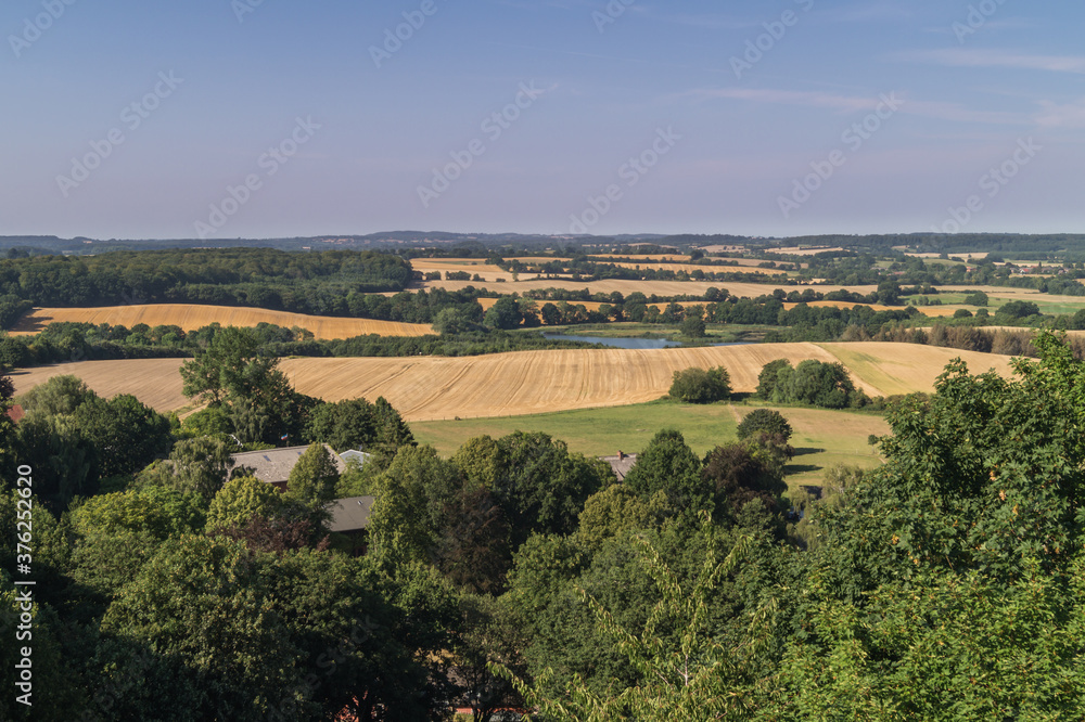 Beautiful aerial landscape view over schleswig holstein in germany. Looking at trees and hills on a nice summer day.