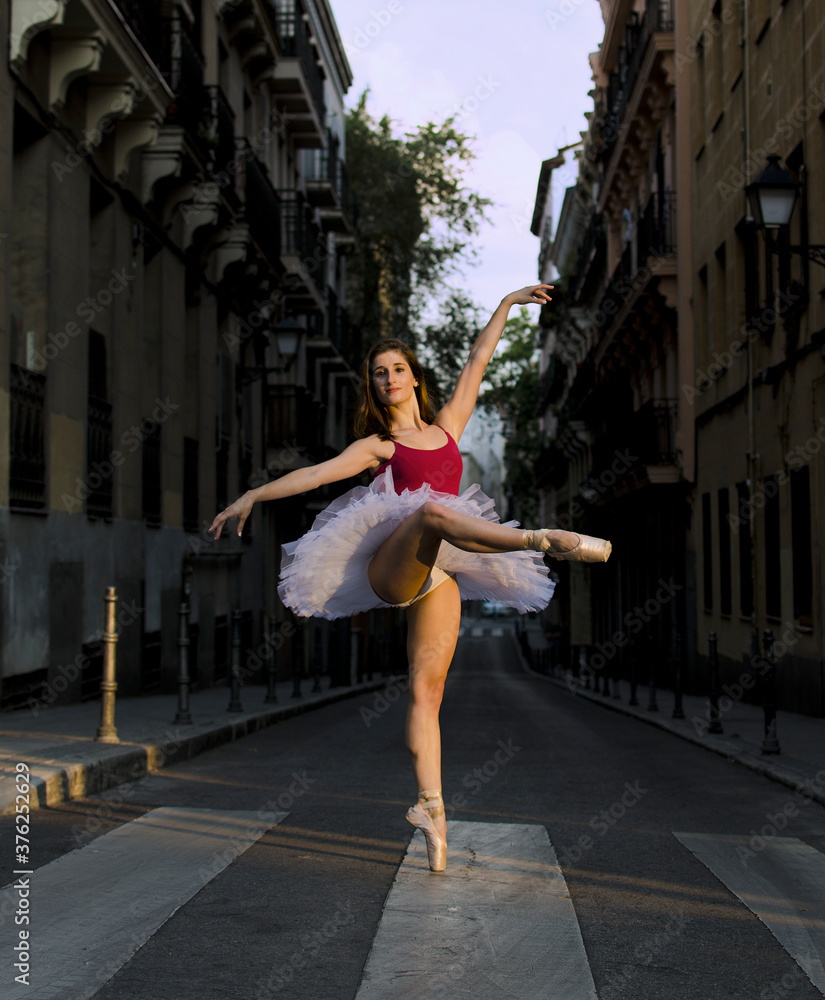 Ballerina on pointe with tutu in the street