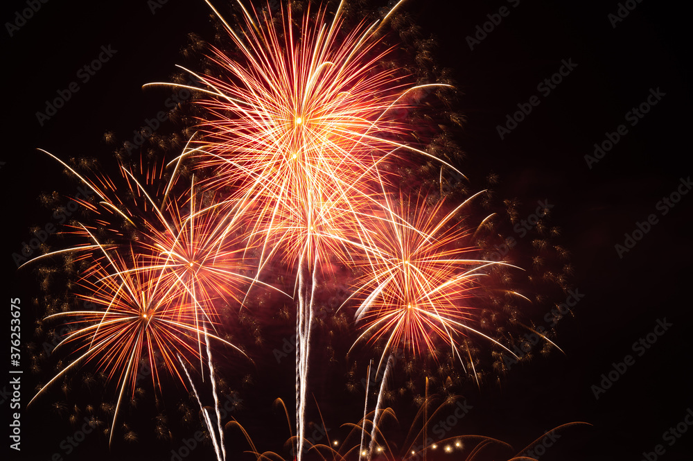 Abstract and brightly colorful firework with free space in the celebration and anniversary festival.Merry Christmas and New year party light over night sky.