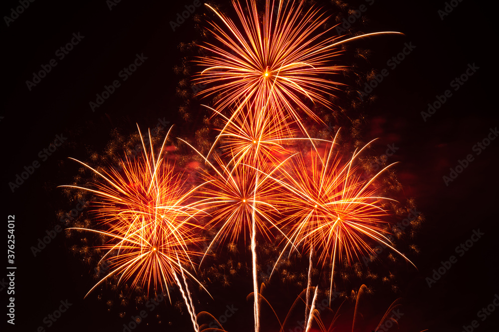 Abstract and brightly colorful firework with free space in the celebration and anniversary festival.Merry Christmas and New year party light over night sky.