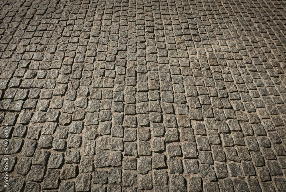 the road is made of stone granite paving stones the road is made of stone granite paving stones