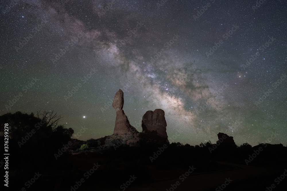 Fototapeta premium Balanced Rock light painted at night in Arches National Park
