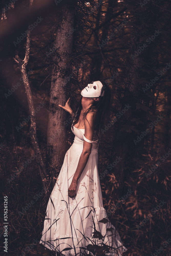 Fototapeta premium Creepy Halloween female portrait with mask