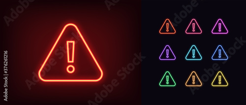 Neon warning icon. Glowing neon warning sign, exclamation mark photo