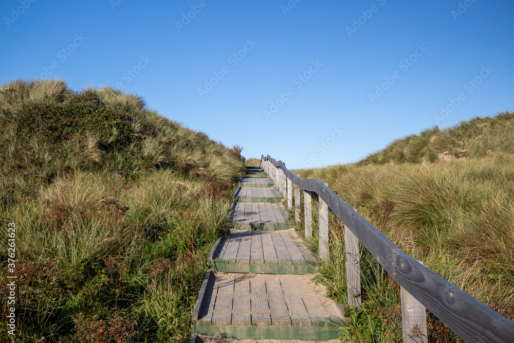 wooden walk way over beach