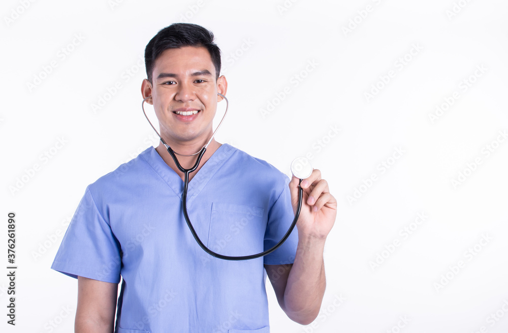 Asian male doctor smiling and using stethoscope while standing on white background