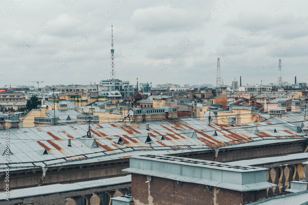 Skyline view on roofs with satellite antennas of old houses Saint Petersburg.