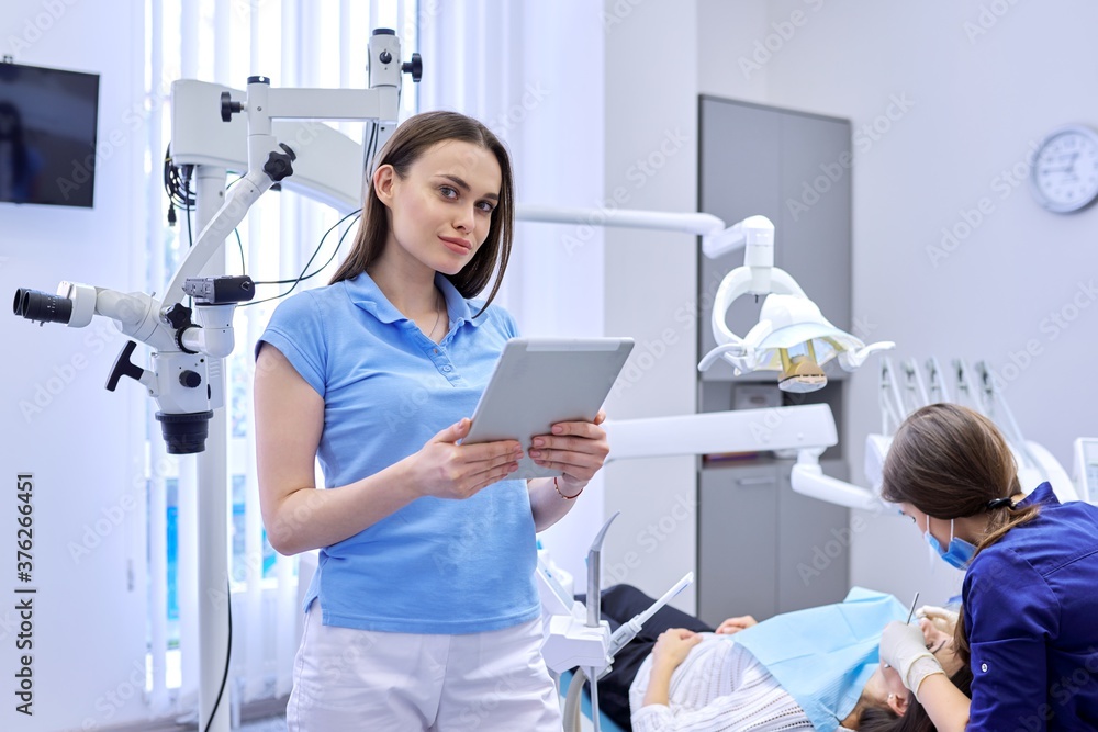 Portrait of dentist doctor with digital tablet Portrait of dentist doctor with digital tablet