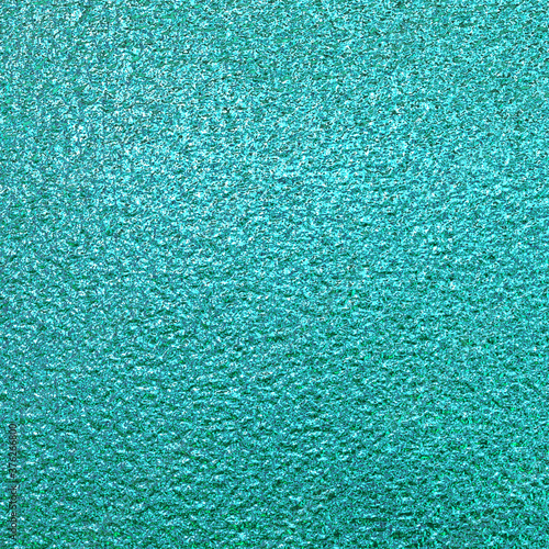 Teal green blue foil paper texture background.