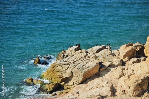 Huge rocks washed by transparent waters of the Mediterranean Sea