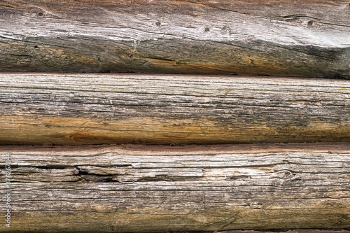Background with texture of old wood surface of round logs