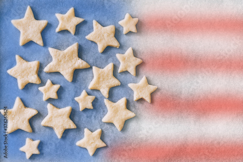 handmade cookies in the shape of stars on parchment paper in the form of an American flag